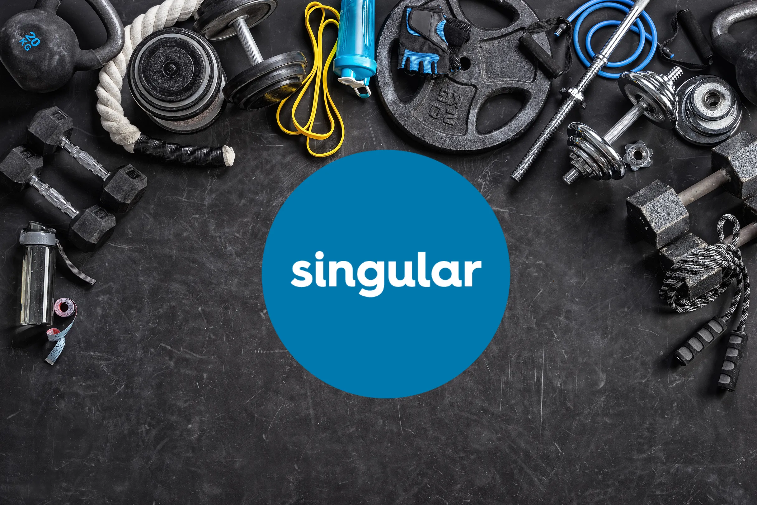 Professional gym setting with training equipment and Singular Movement logo