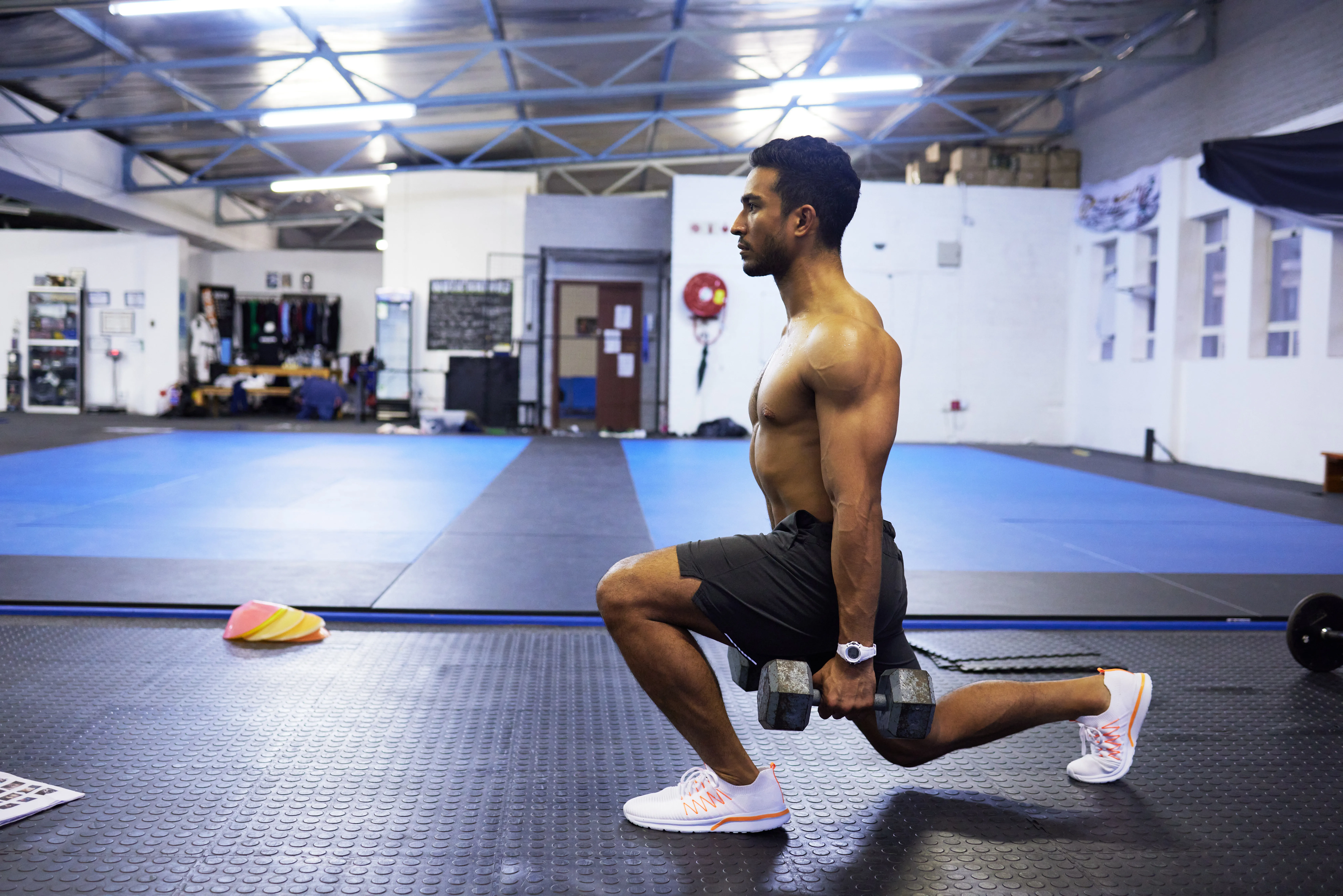 A man doing a forward lunge exercise