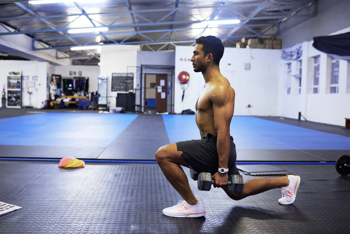 A man doing a forward lunge exercise